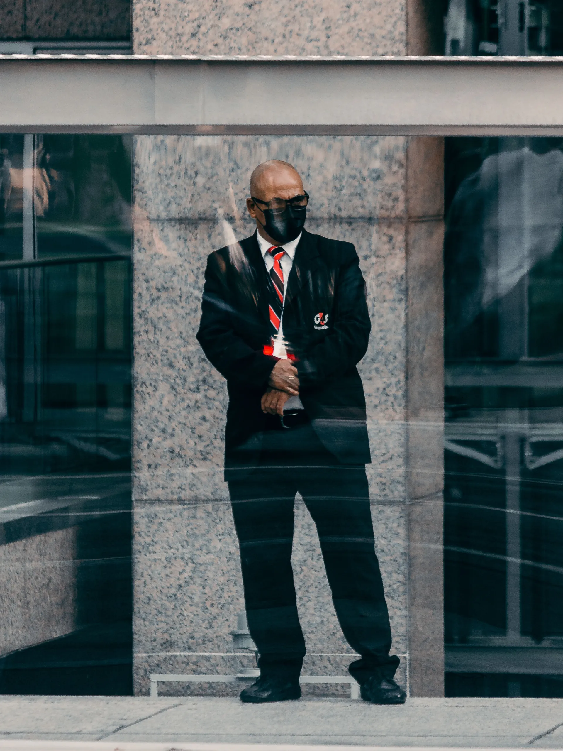 Security professional monitoring a controlled-access property