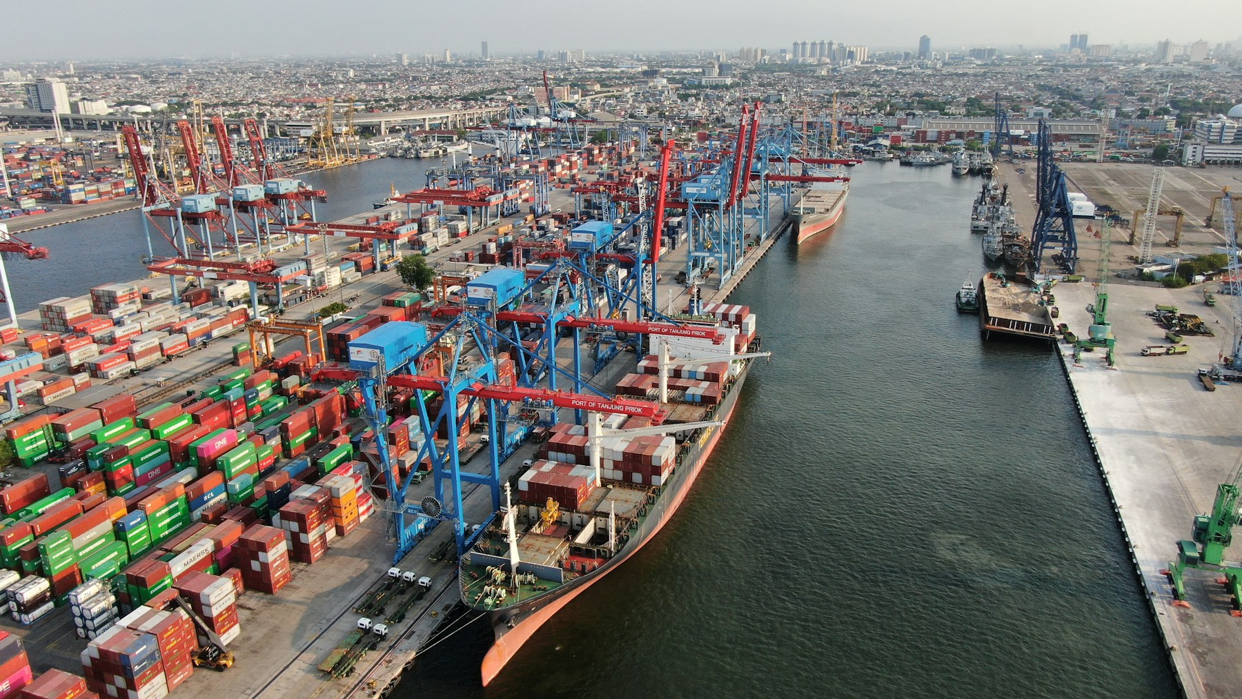 Container vessels and cranes at a busy seaport