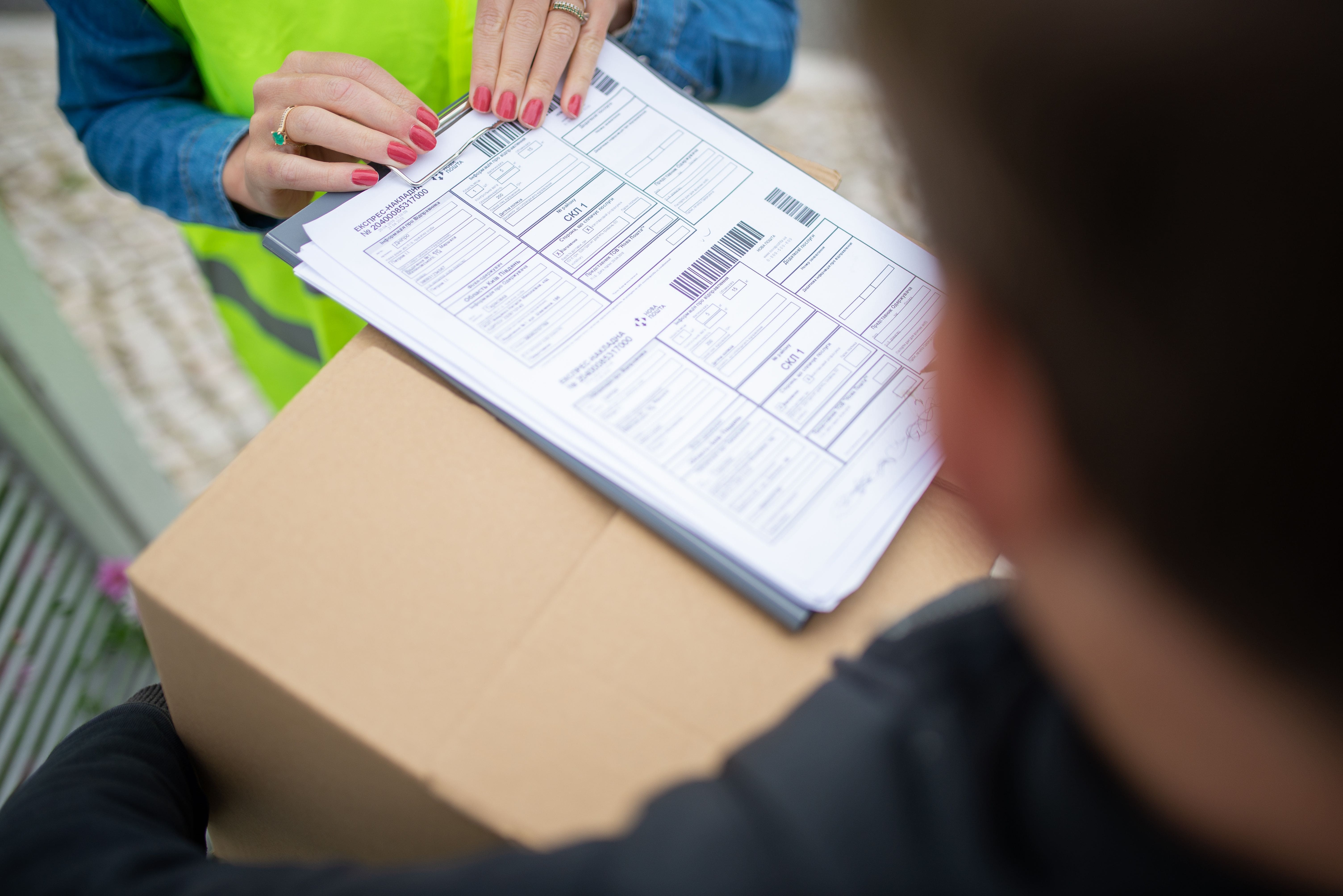 Delivery paperwork being confirmed at handover