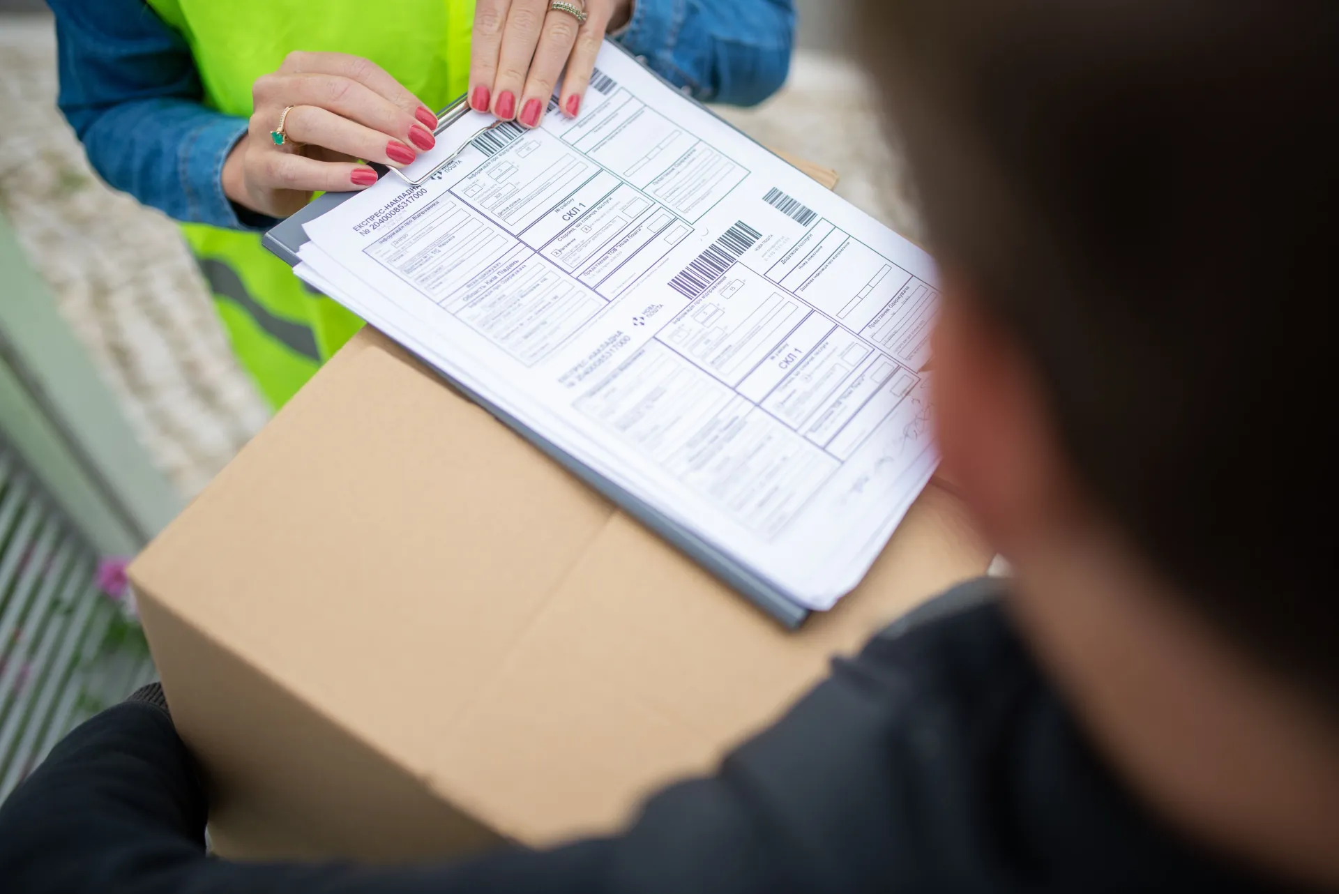 Delivery paperwork being confirmed at handover